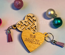 Load image into Gallery viewer, Valentine's Day gift, heart-shaped wooden maze puzzle with metal bead and clear acrylic top, with attached metal ring and colorful tassel by @belcreativearts