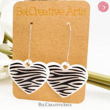 Load image into Gallery viewer, Zebra stripe heart earrings, white, dangle style, made in USA