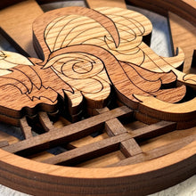 Load image into Gallery viewer, Three-layered Christmas ornament, approximately 4&quot; in diameter, made of multiple hardwood veneers, depicting a fancy rooster sitting on a barnyard fence with sun rays in the background.  Made in Virginia by @BelCreativeArts.
