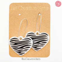 Load image into Gallery viewer, Zebra stripe heart earrings, white, dangle style, made in USA
