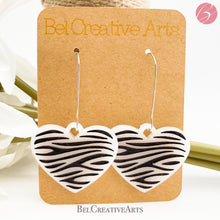 Load image into Gallery viewer, Zebra stripe heart earrings, white, dangle style, made in USA
