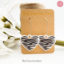Load image into Gallery viewer, Zebra stripe heart earrings, white, dangle style, made in USA
